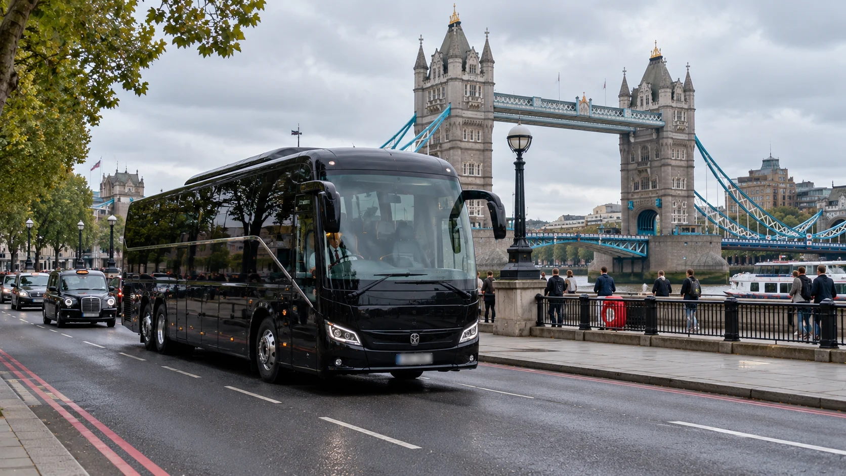 Black coach on the Thames embankment near Tower Bridge